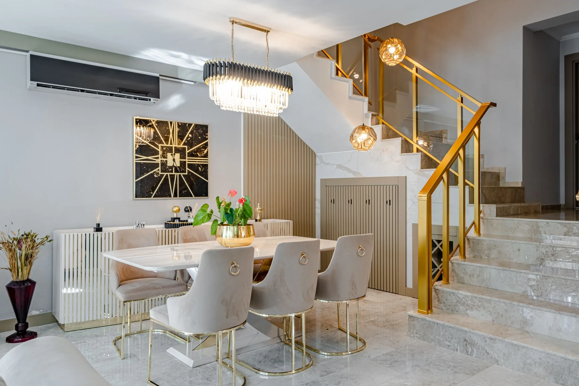 Refined dining space with statement lighting and curated furnishings